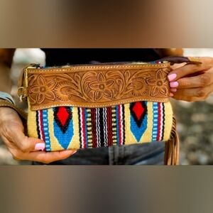 Aztec tooled leather wristlet